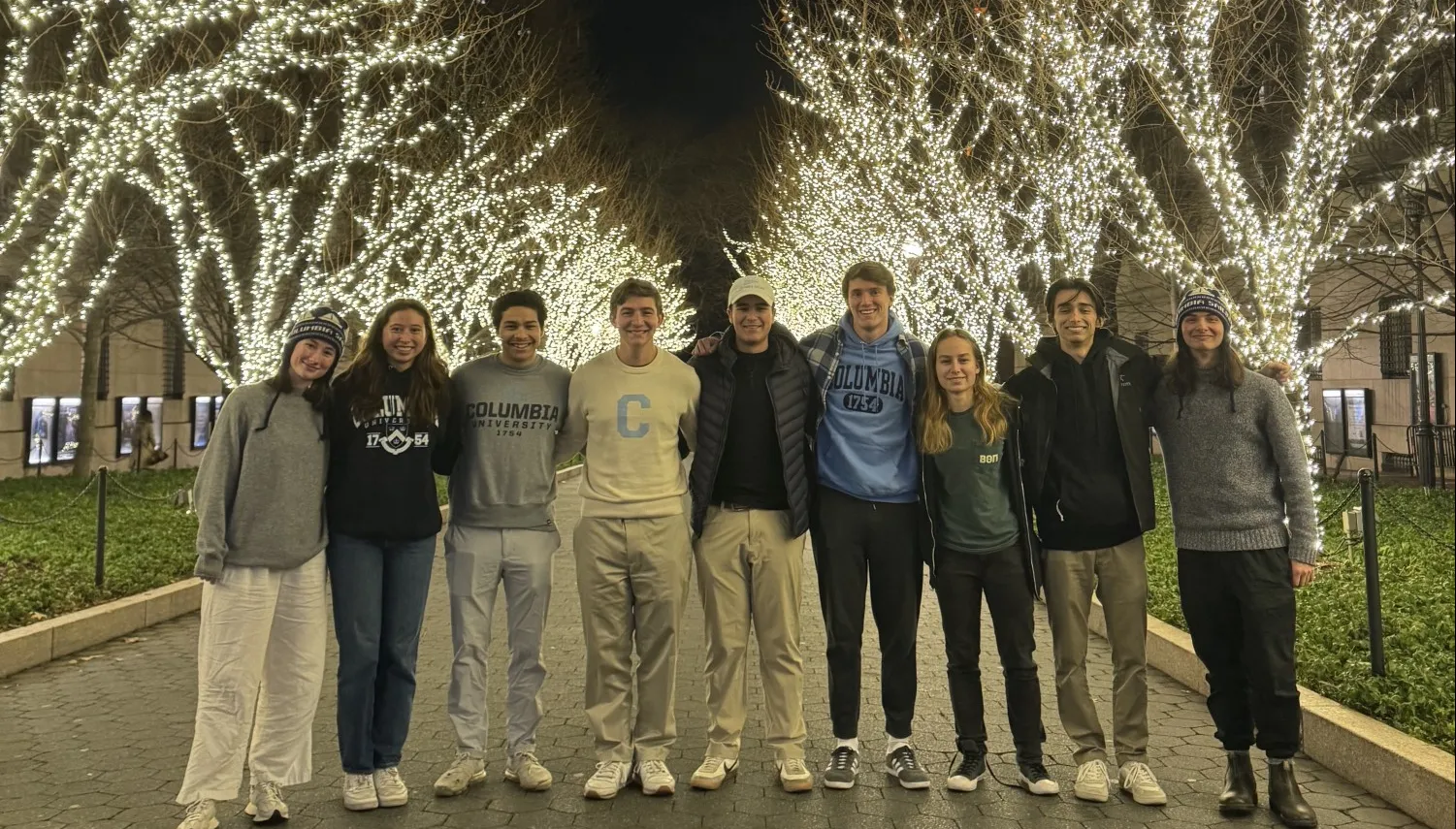Board in front of tree lights